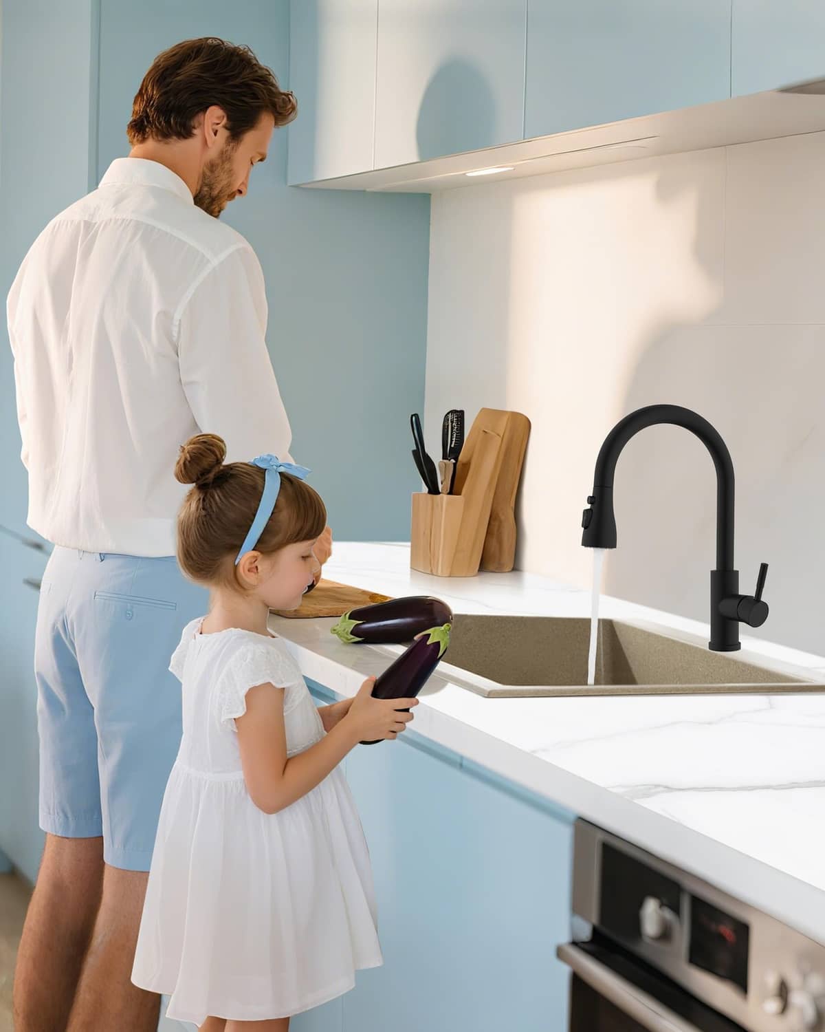 Matte black kitchen faucet with pull-down sprayer producing water flow
