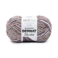 Bernat Super Bulky chenille-style yarn skein in mauve, purple, and gray tones