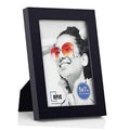Black 5x7 table picture frame with glass, displaying a photo portrait