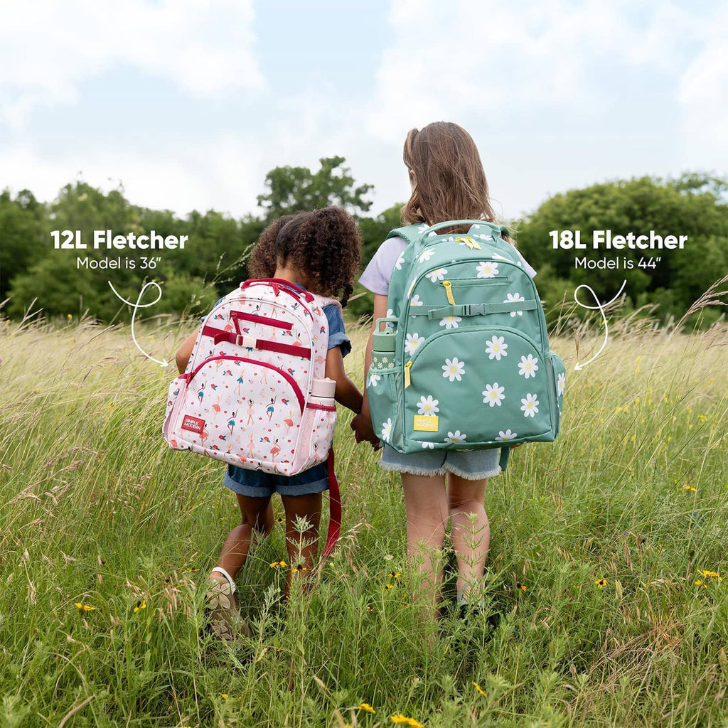 Children wearing toddler backpacks with colorful animal prints outdoors