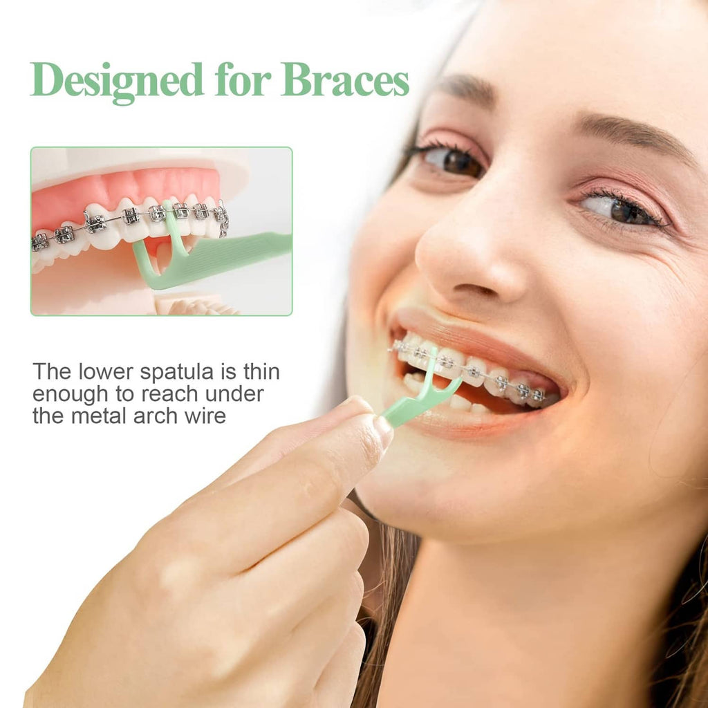 Green orthodontic flosser cleaning braces with toothpick end