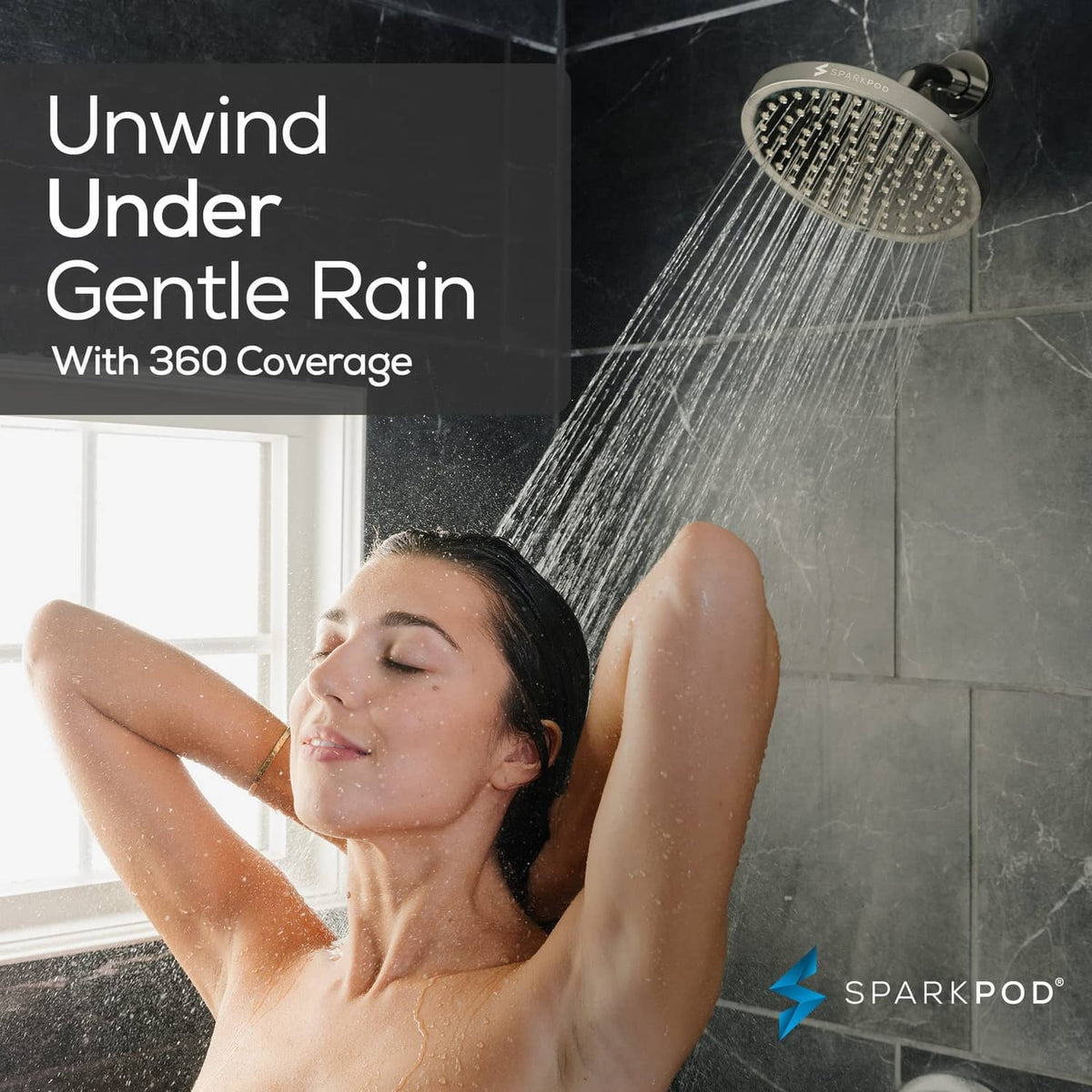 Overhead brushed nickel rain shower head delivering wide 360-degree water coverage spray