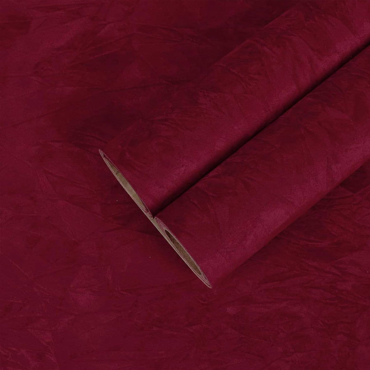 Dark red velvet flocking liner sheet, visible backing edge and dense soft pile