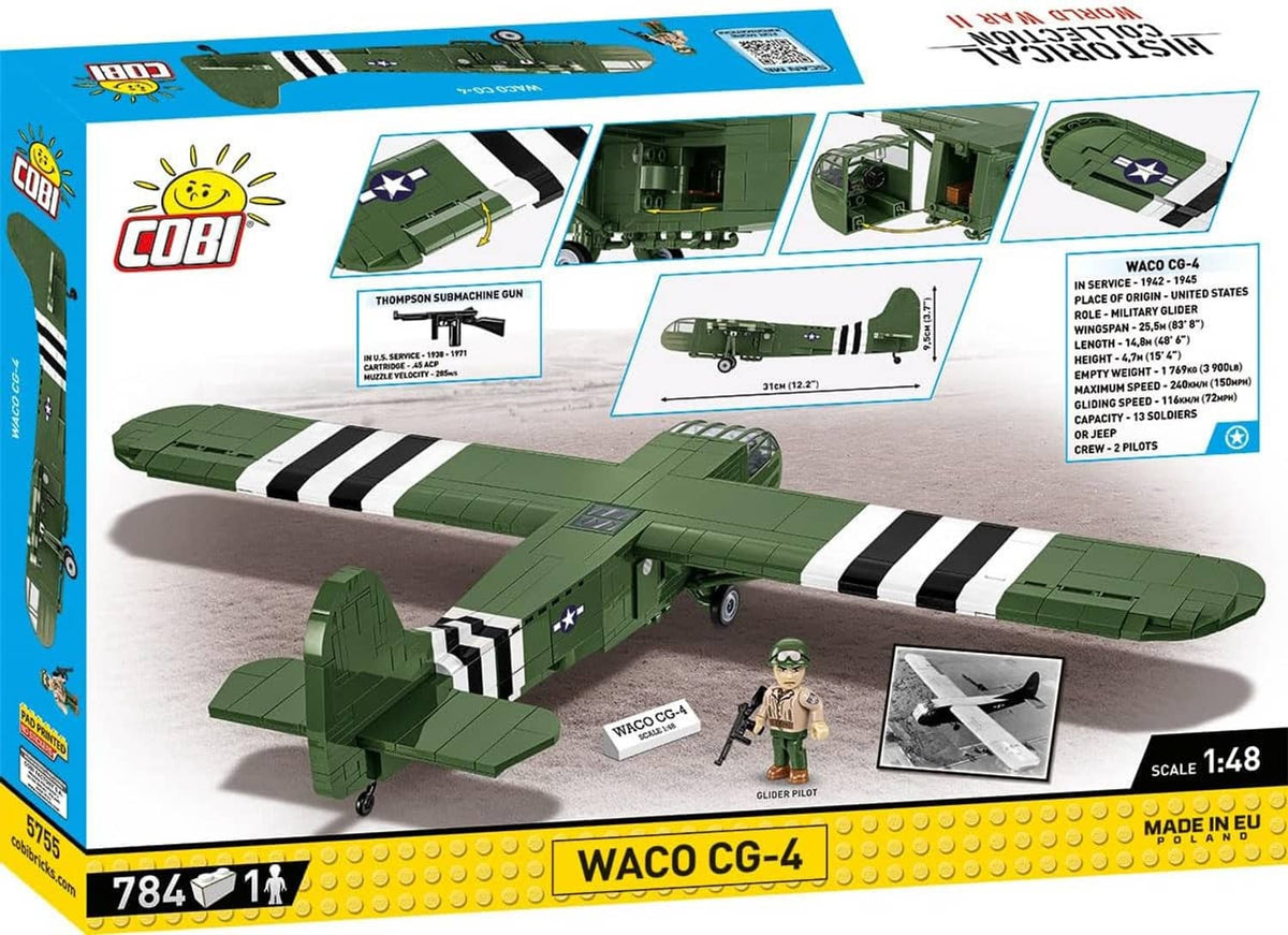 Green WWII WACO CG-4 model glider with black-and-white stripes and landing gear