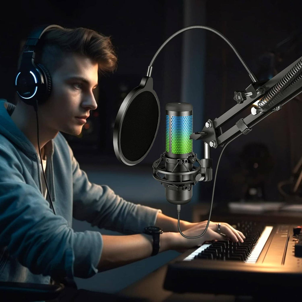 Pop filter shield in front of a condenser microphone in a dark studio setting
