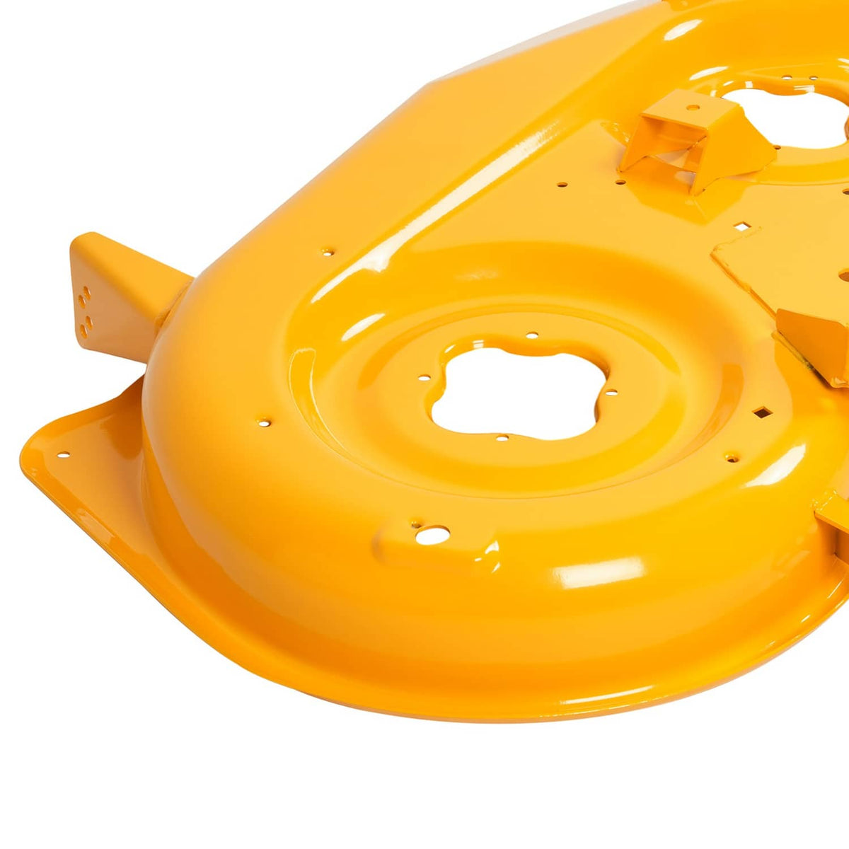 Close view of yellow mower deck shell with circular center opening