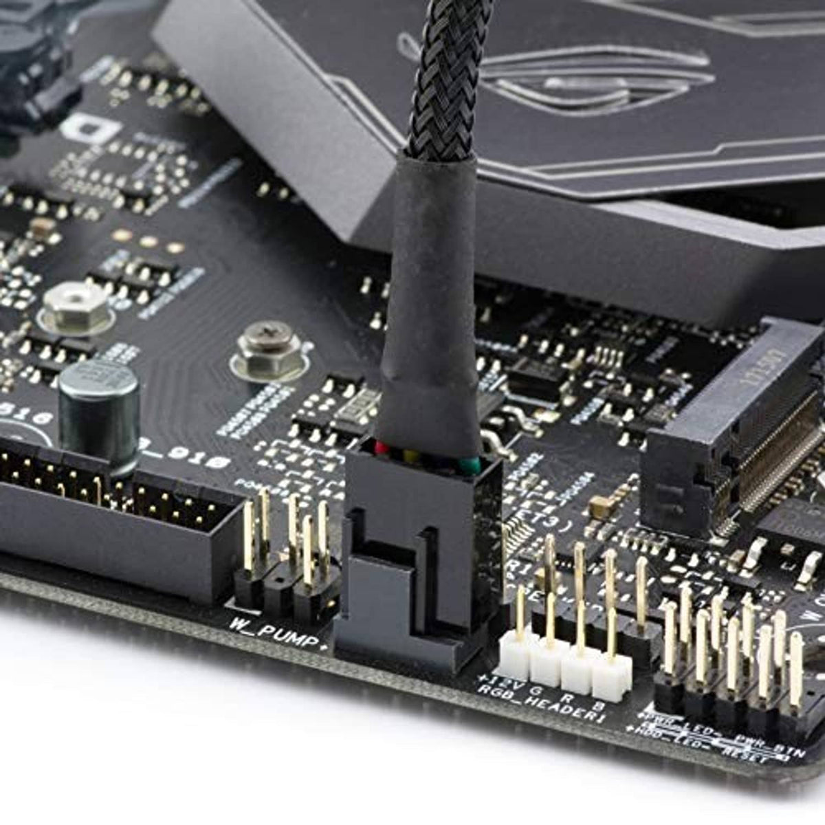 Micro 4-pin adapter cable plug inserted on a motherboard header