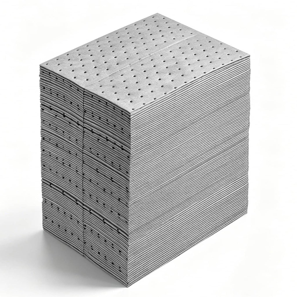 Crisp stack of gray absorbent pads with perforated dot pattern on top sheet
