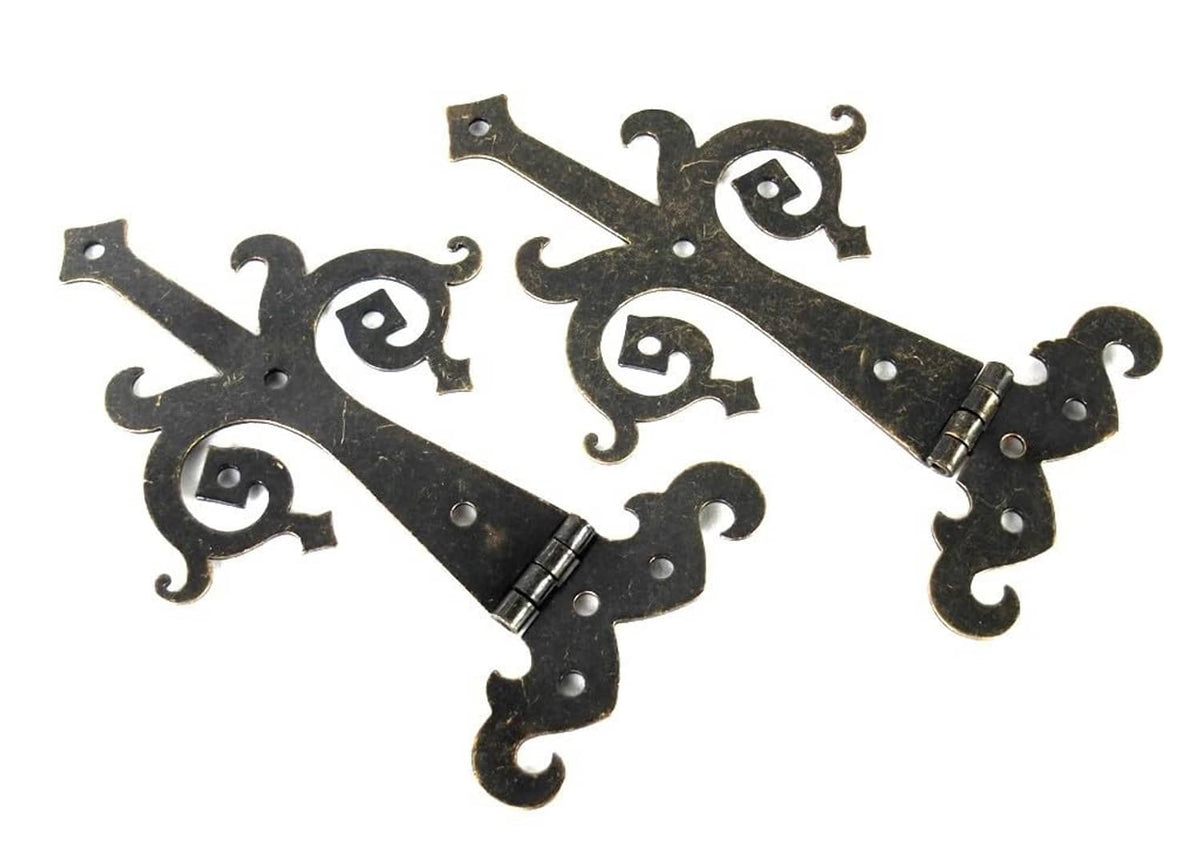 Medieval bronze strap hinges with decorative scrollwork, two-piece set
