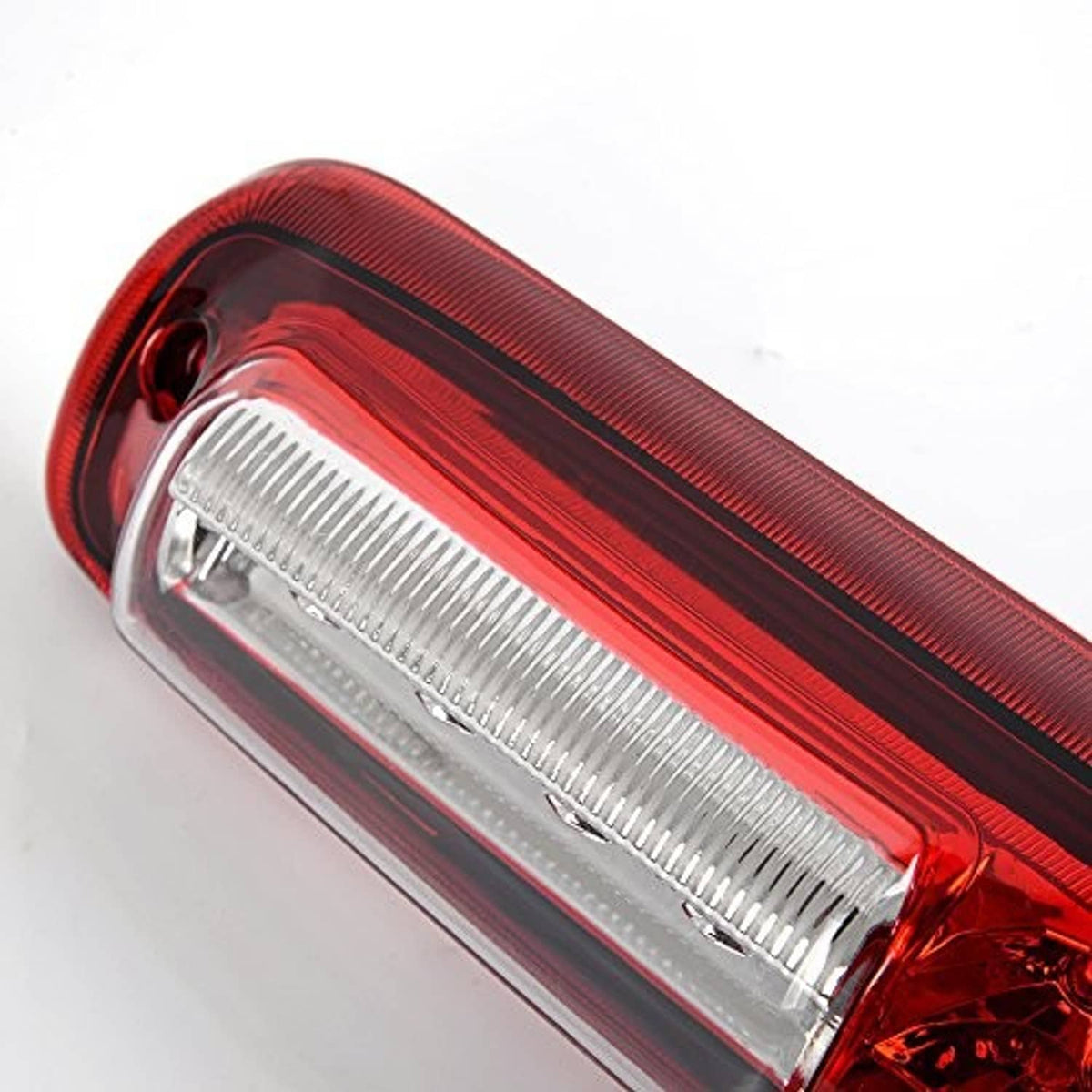 Clear-lensed third brake light corner with red housing and internal reflector details