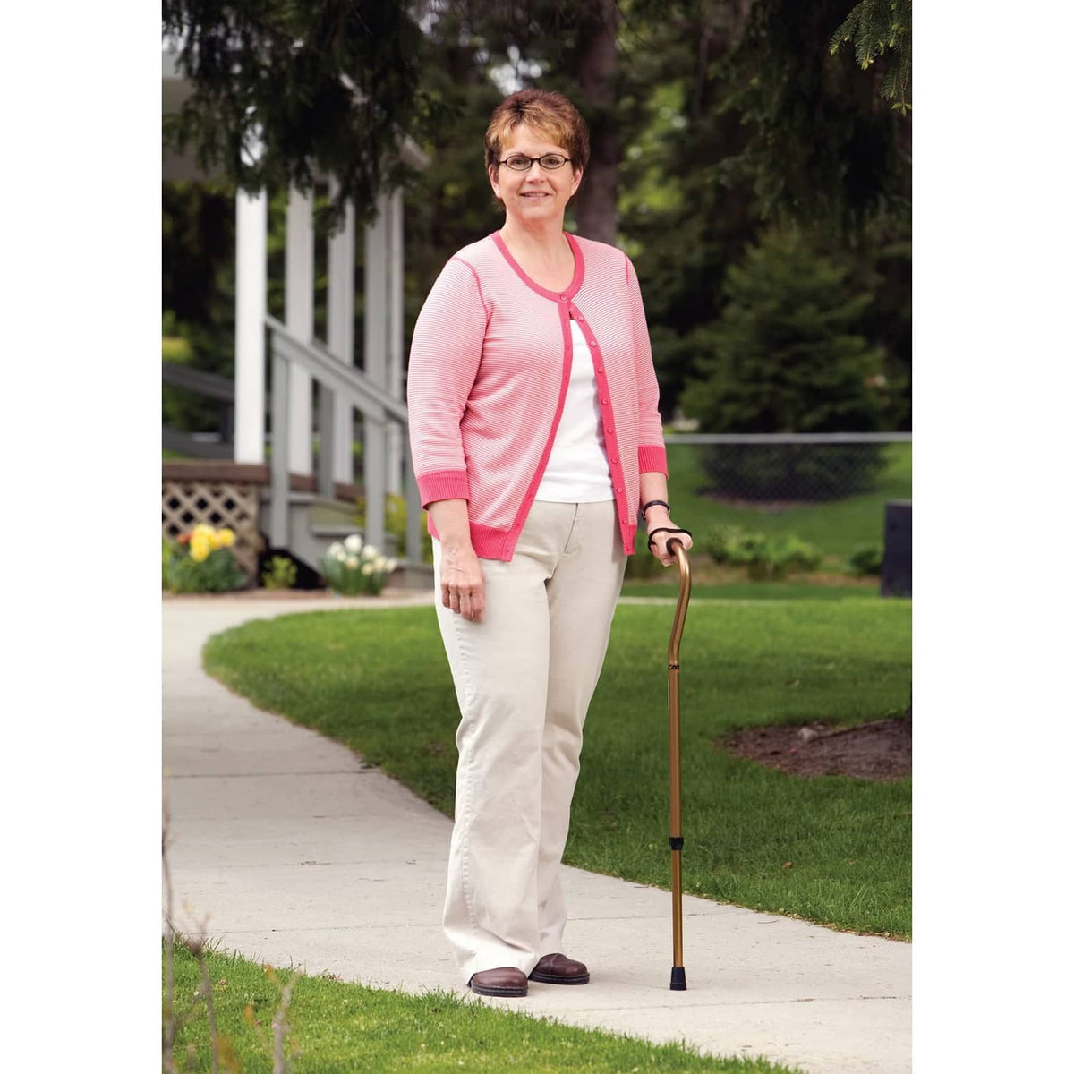 Offset walking cane with cushioned handle and black wrist strap, aluminum shaft