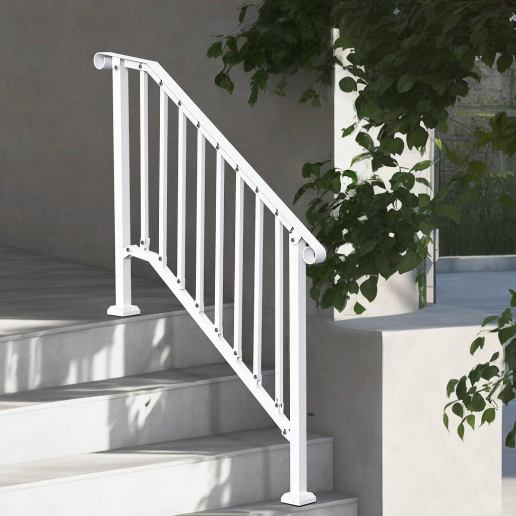 White outdoor stair railing with vertical balusters beside planter and steps