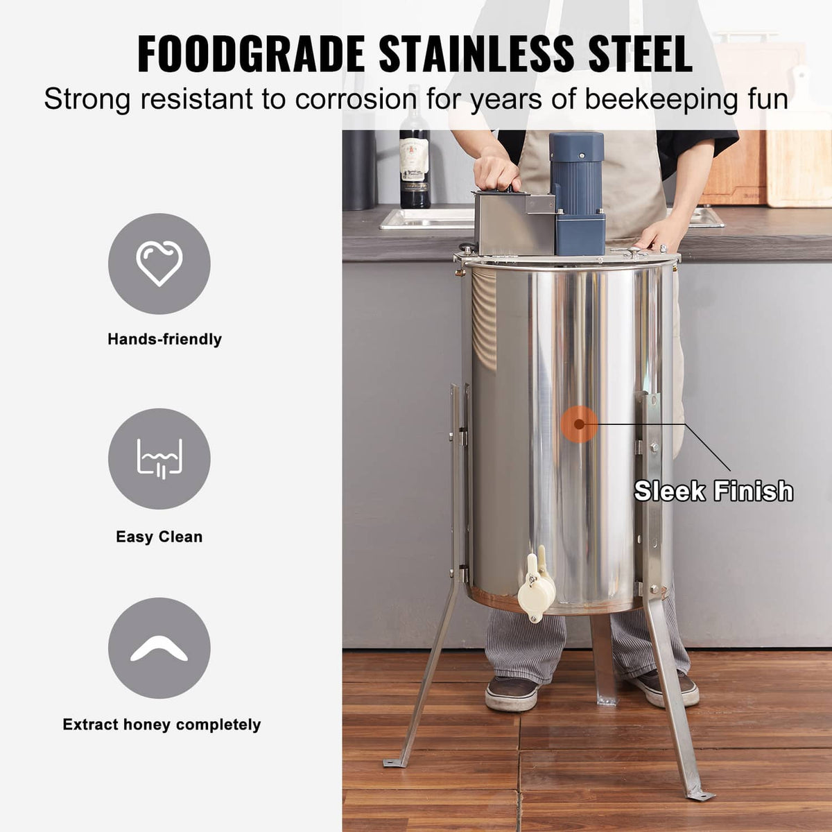 Stainless steel honey extractor on tripod stand with honey gate and sleek finish
