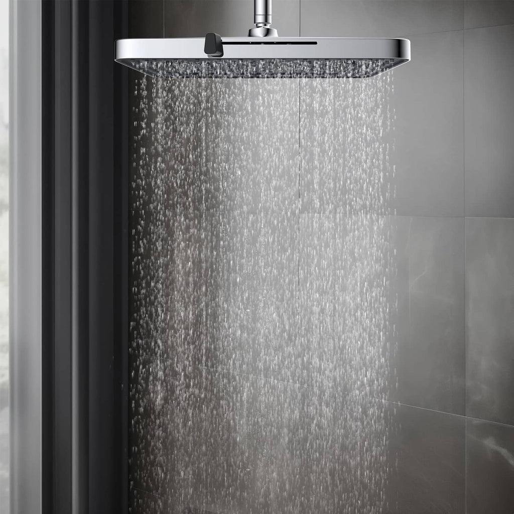 Chrome rainfall shower head producing dense overhead water stream