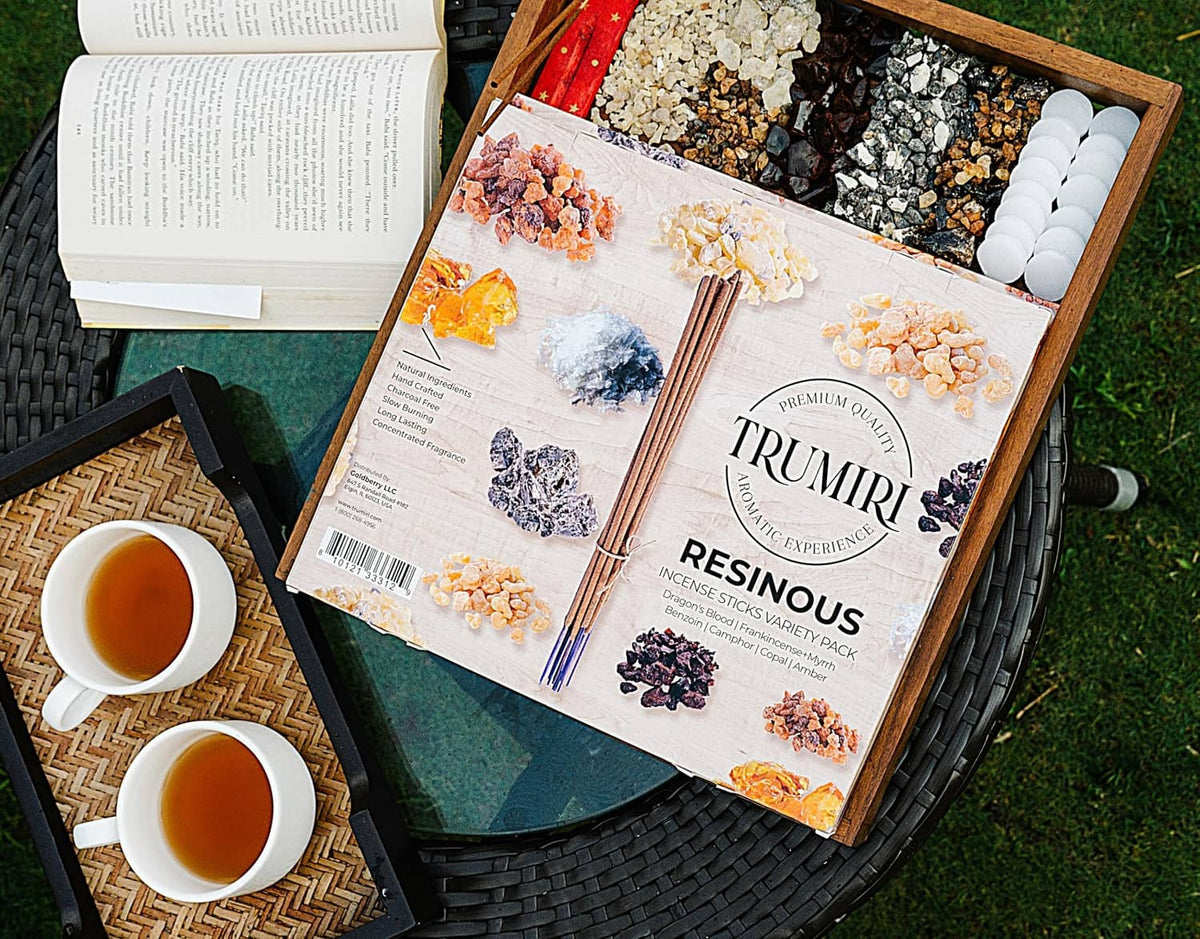 Trumiri resinous incense stick box on a woven tray with loose incense sticks
