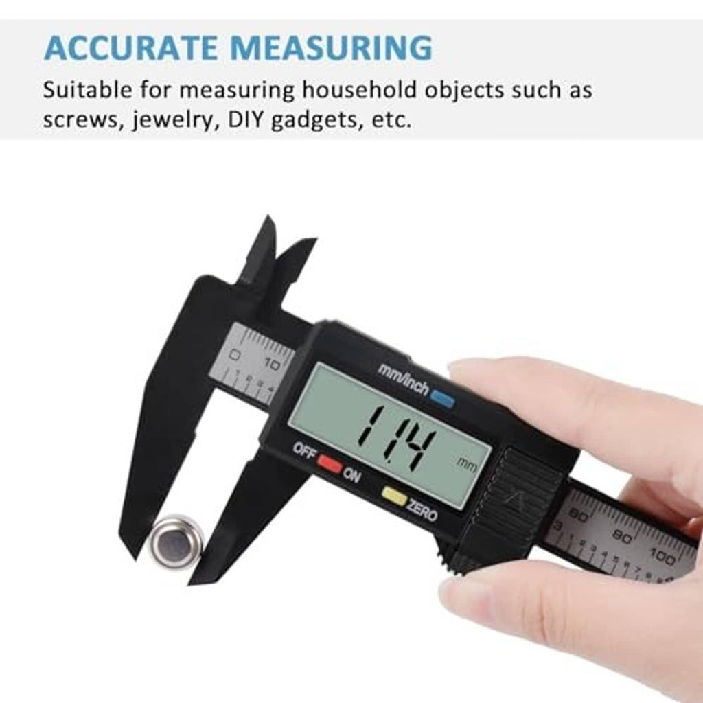 Black digital caliper in hand with LCD readout and external measuring jaws