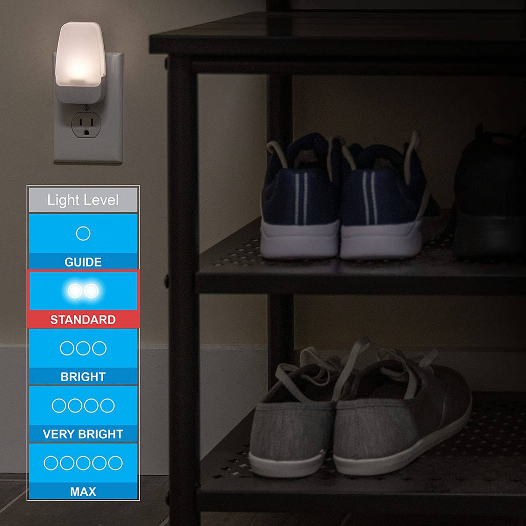 Plug-in LED night light illuminating closet shelves with warm white light