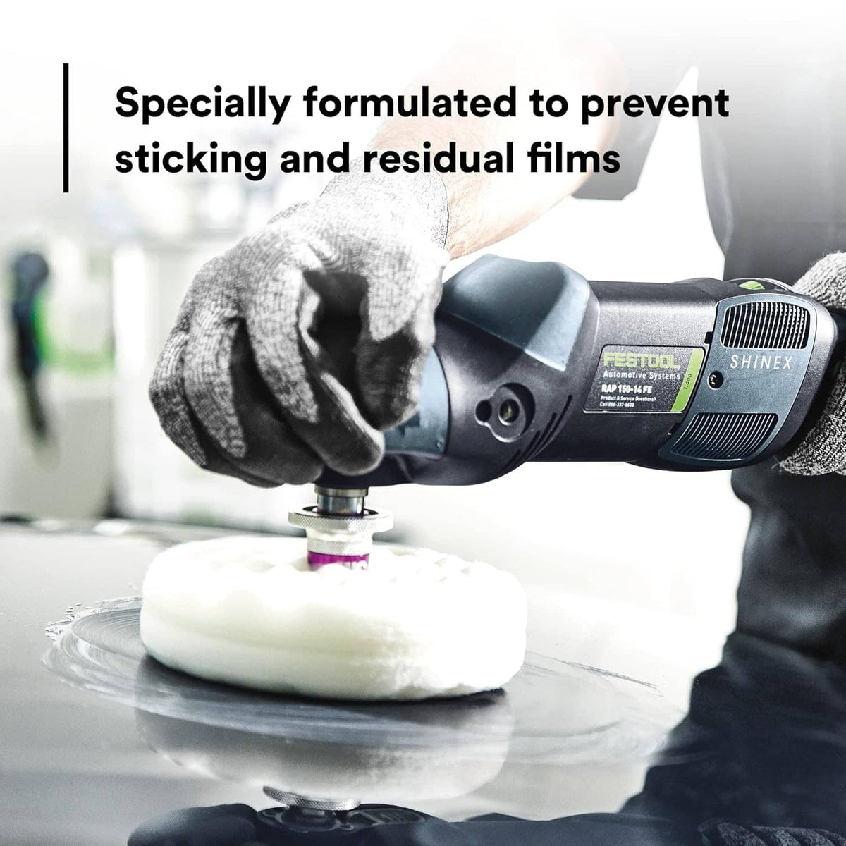 Foam polishing pad with car compound on a polishing tool, gloved hand holding it