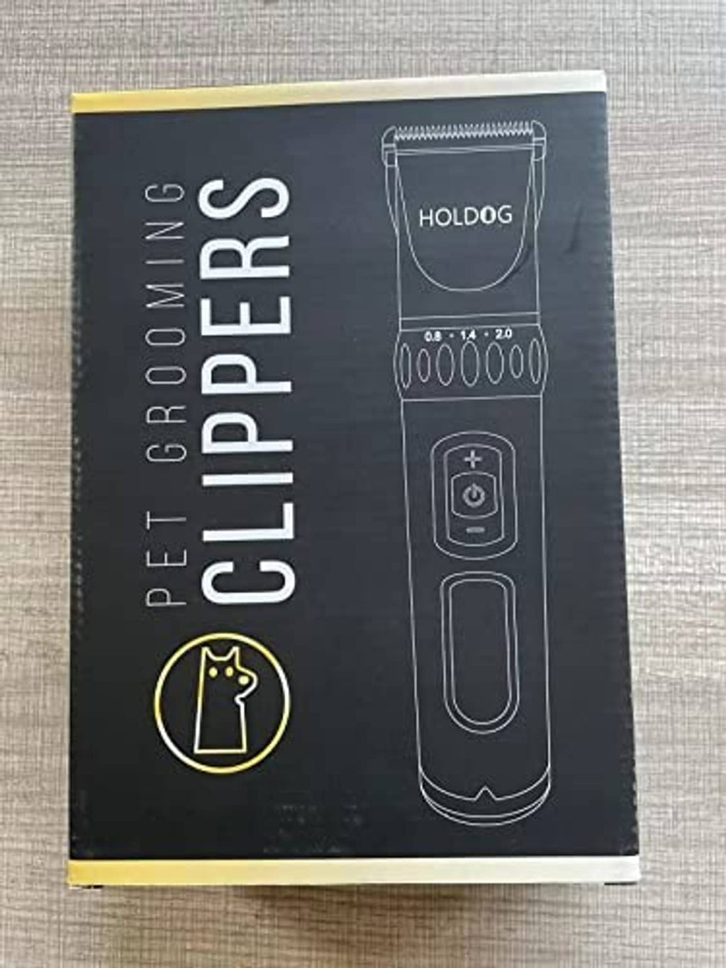 Dog grooming clipper retail box with Holdog branding and blade graphic
