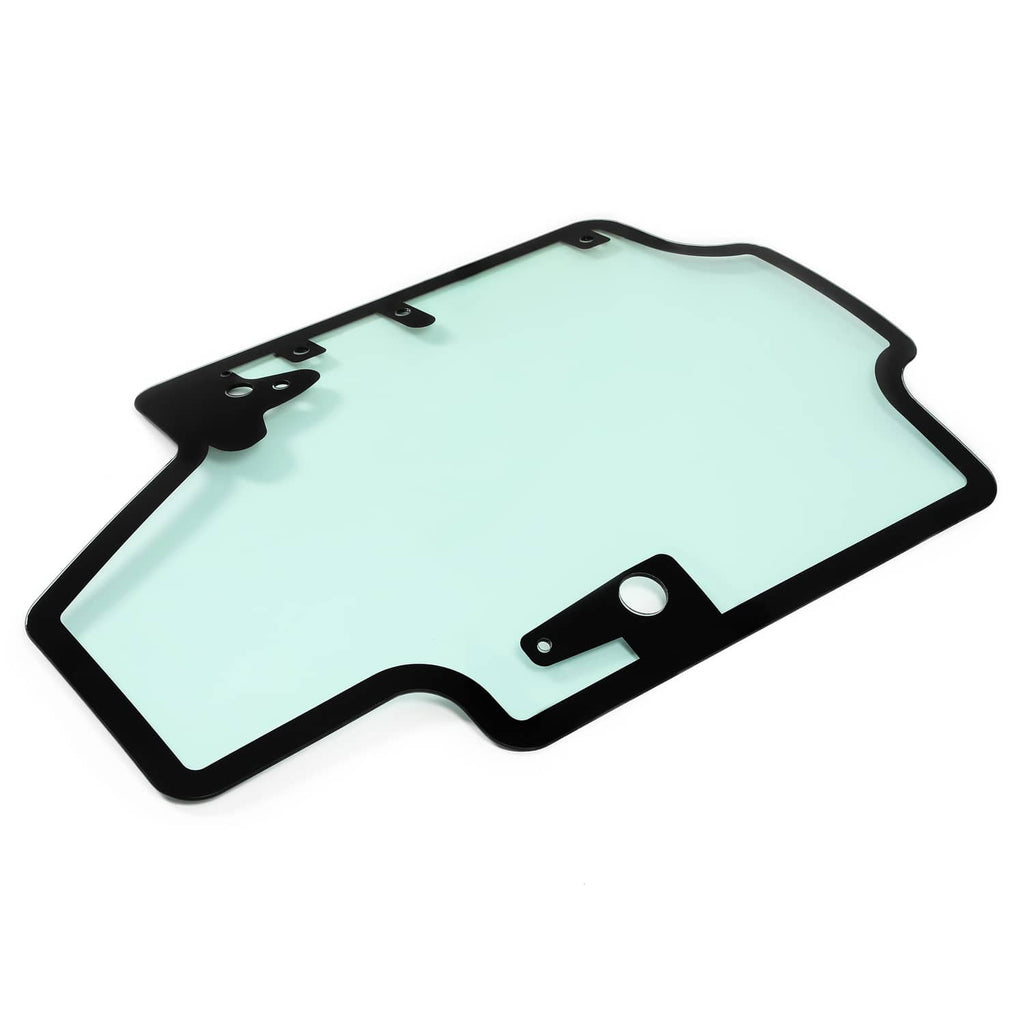 Skid steer door glass panel with black frame and side mounting brackets, light blue tint