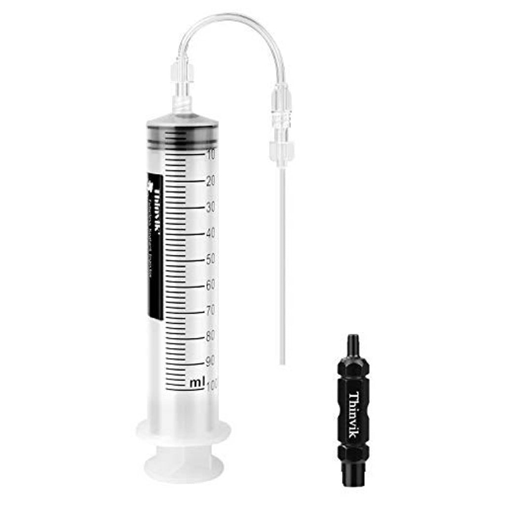 Bike tubeless sealant injector syringe with measurement markings and black applicator