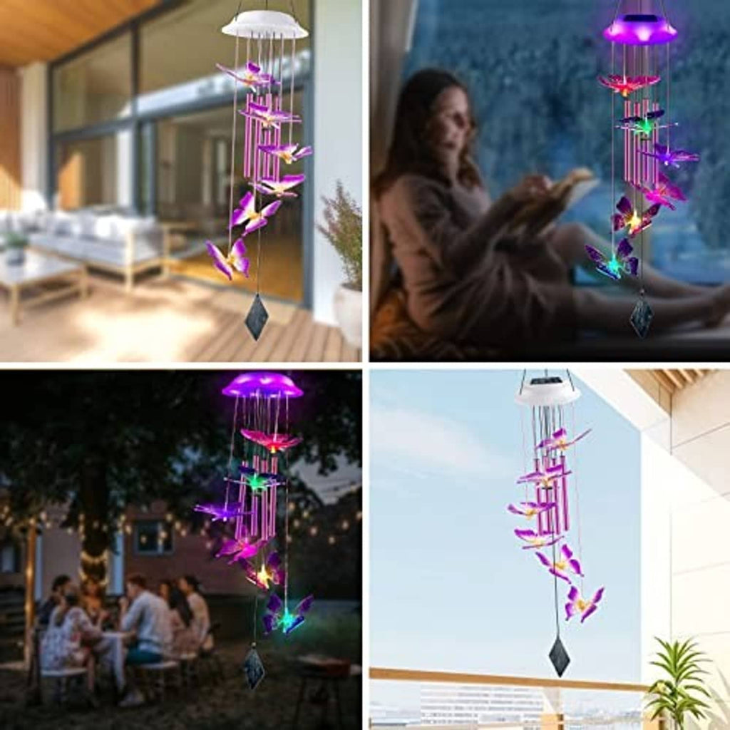 Glowing solar butterfly wind chime with colorful butterfly silhouettes on light tubes and diamond weight
