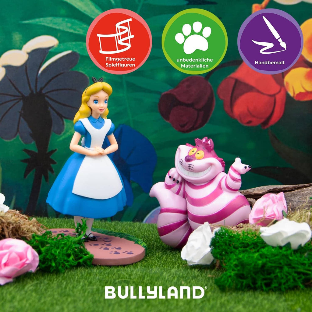 Cheshire Cat figurine in pink and purple stripes, smiling face and raised paw