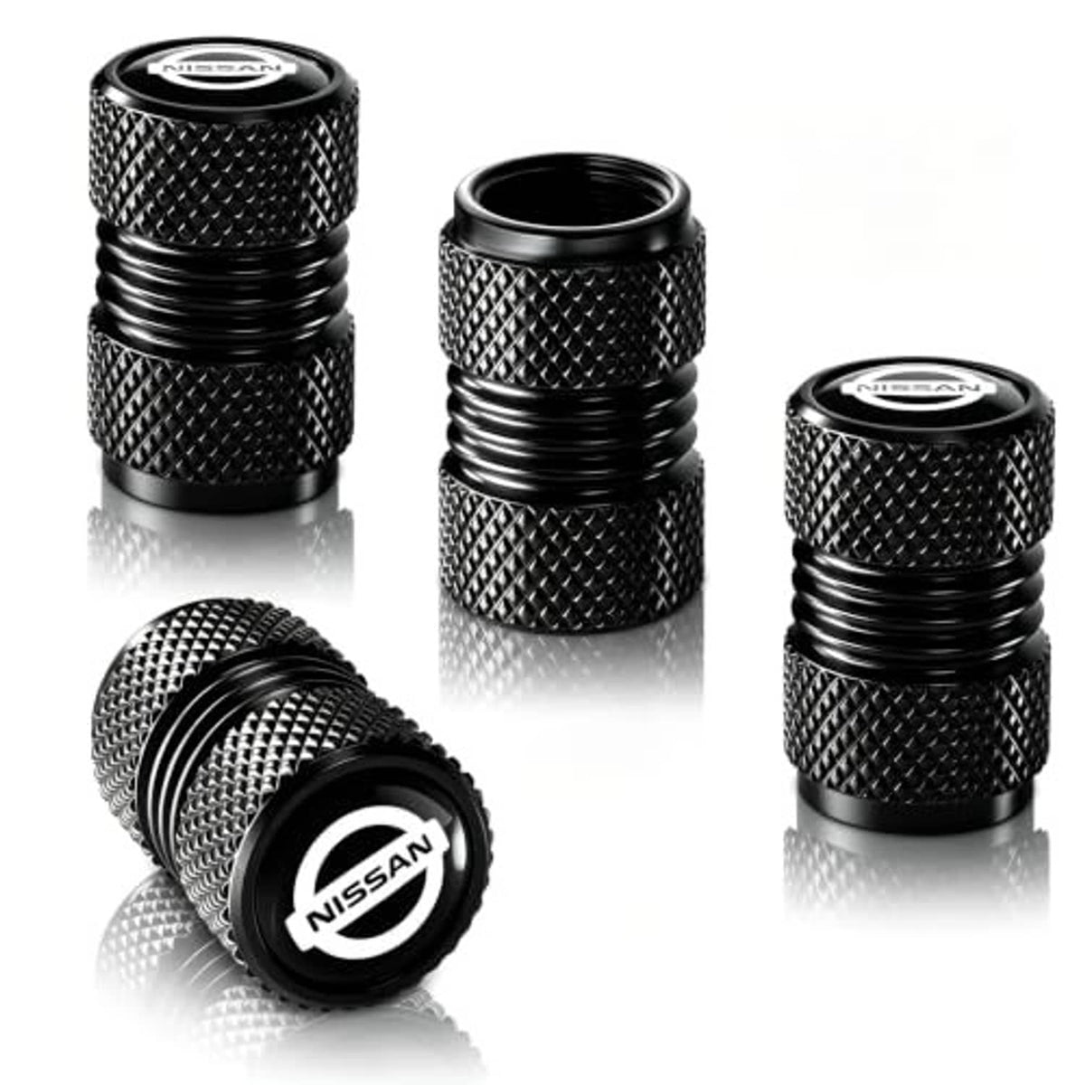 Black textured tire valve stem caps with Nissan logo, three-piece set