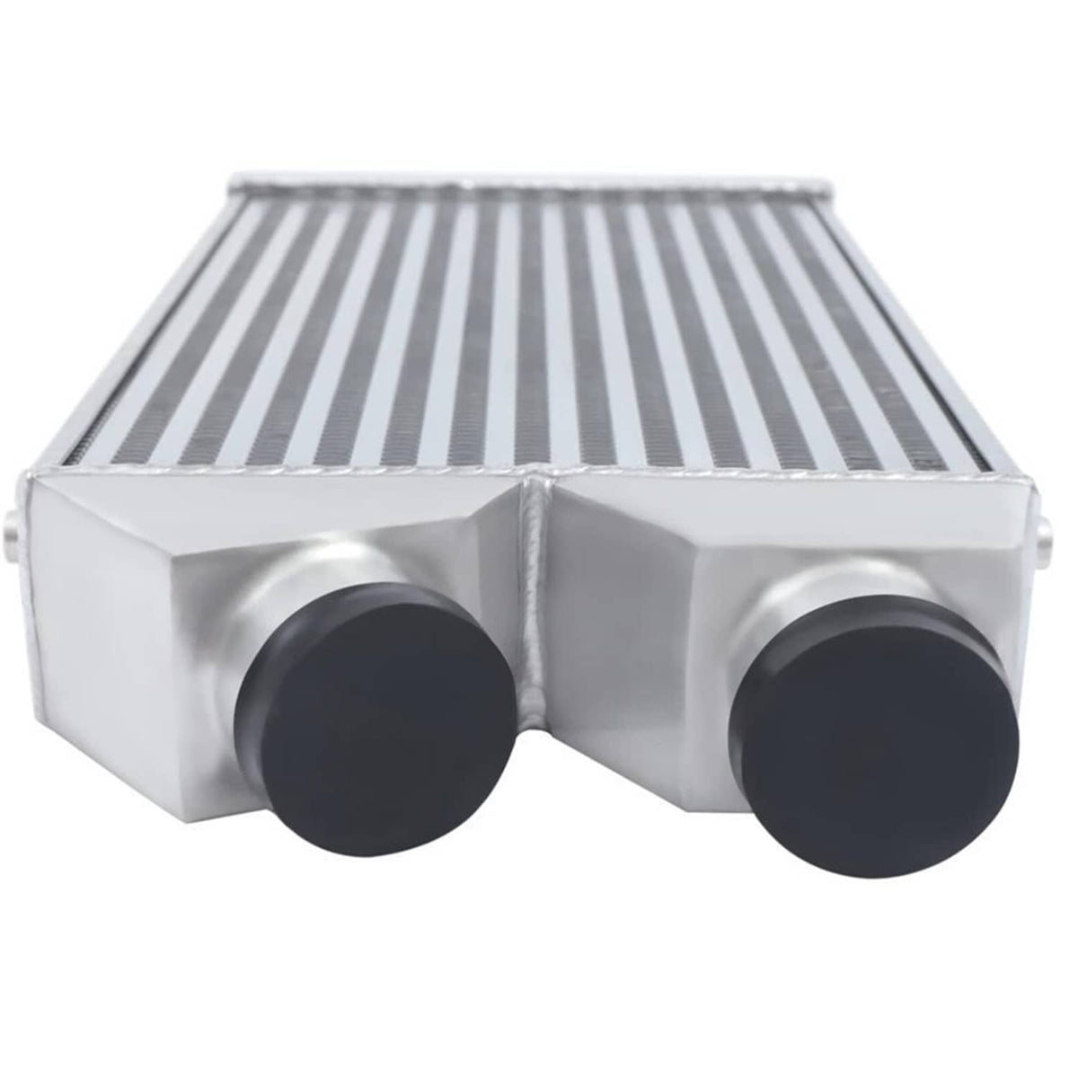 Aluminum intercooler end view showing two black inlet/outlet ports and stacked fins
