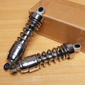 Pair of chrome rear shock absorbers with coil springs and top mounting bushings