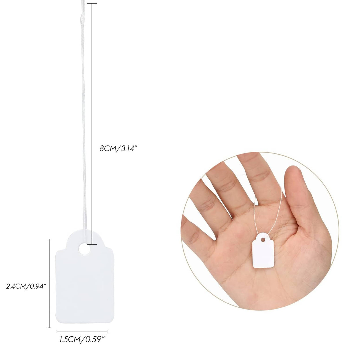 White rectangular price tag with string, shown with small hand for scale