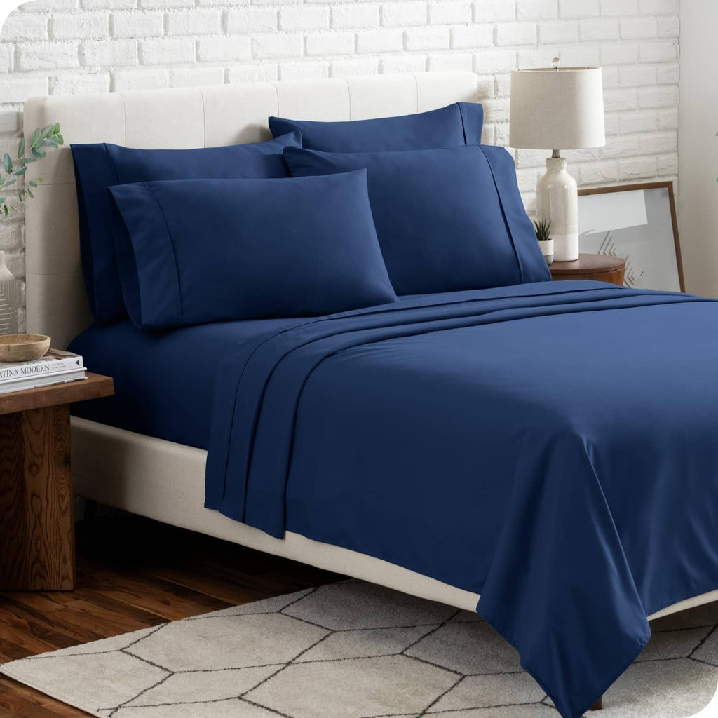 Dark blue twin XL sheet set with two pillowcases and matching flat and fitted sheets