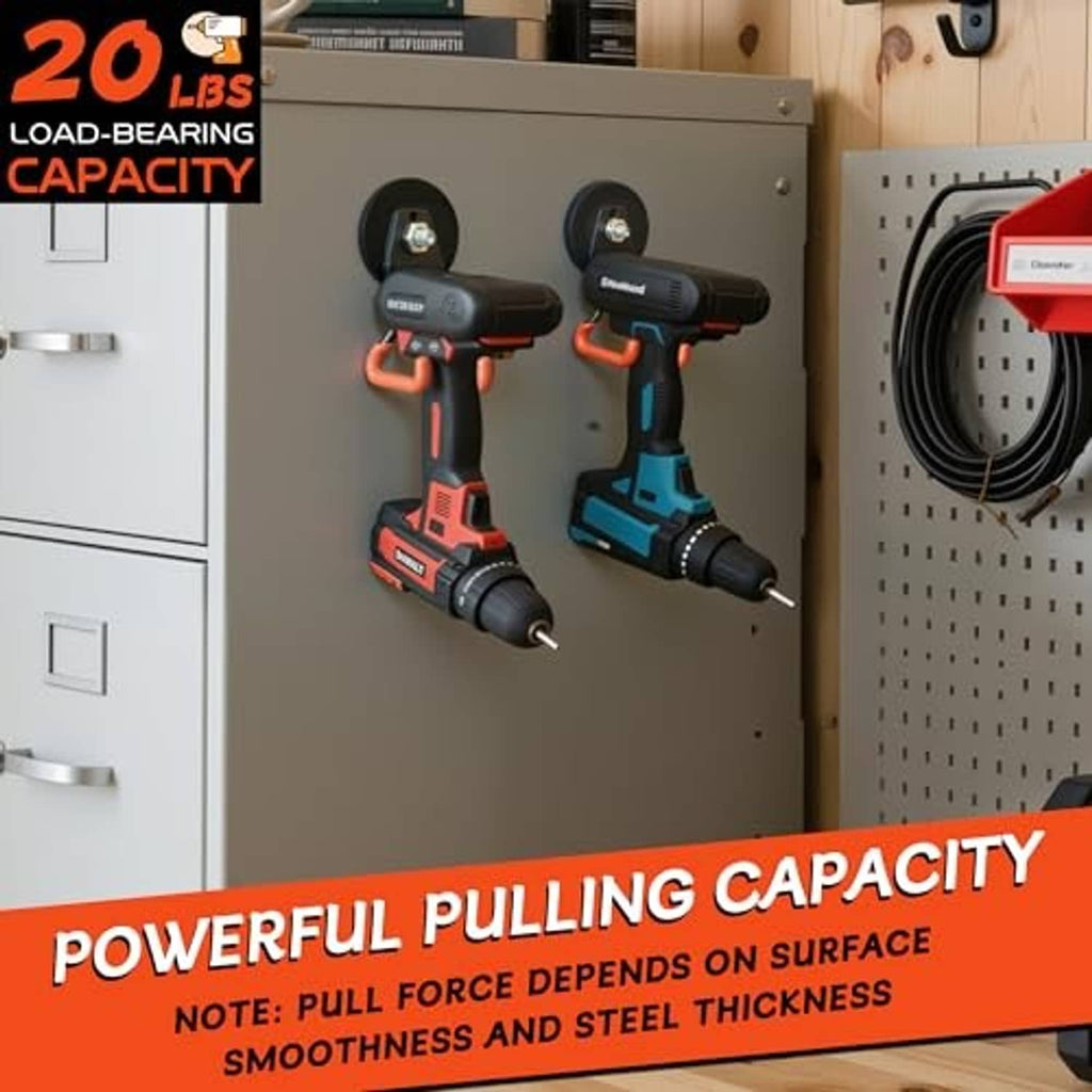 Orange and black magnetic hooks mounted on a workshop metal board near tools