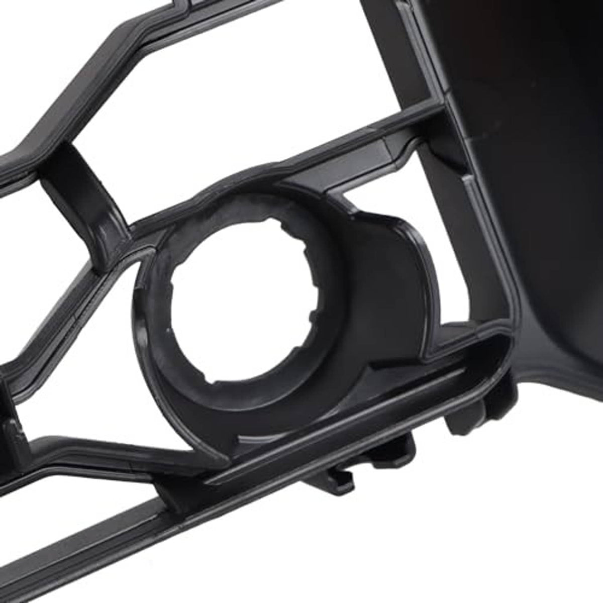 Black grille corner detail with round sensor/fastener opening