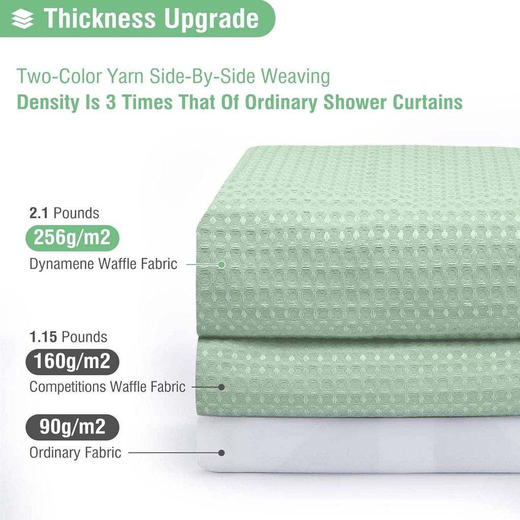 Mint green waffle-weave shower curtain fabric close-up, thick textured weave on layered stack
