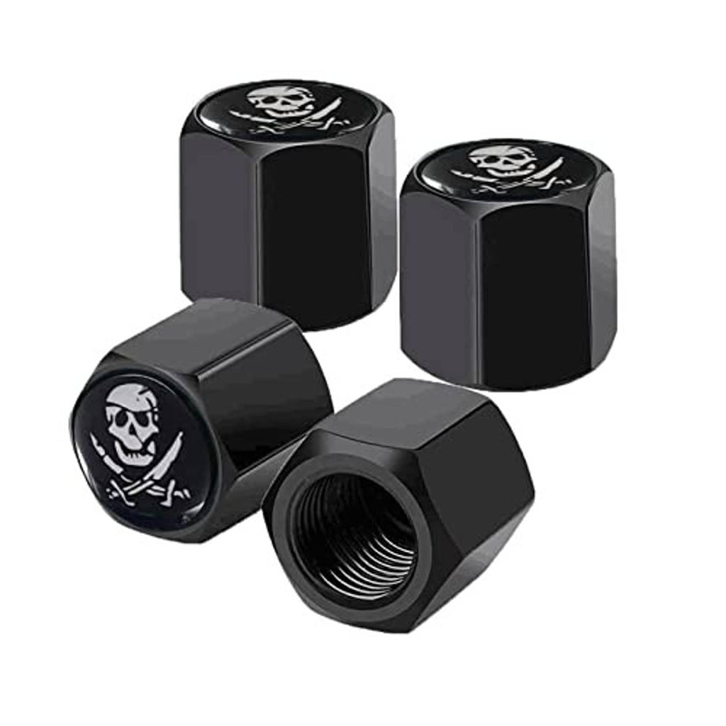 Four black pirate skull tire valve stem caps with rubber seal rings, front angle