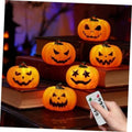 Halloween orange pumpkin tea lights with glowing jack-o’-lantern faces and remote
