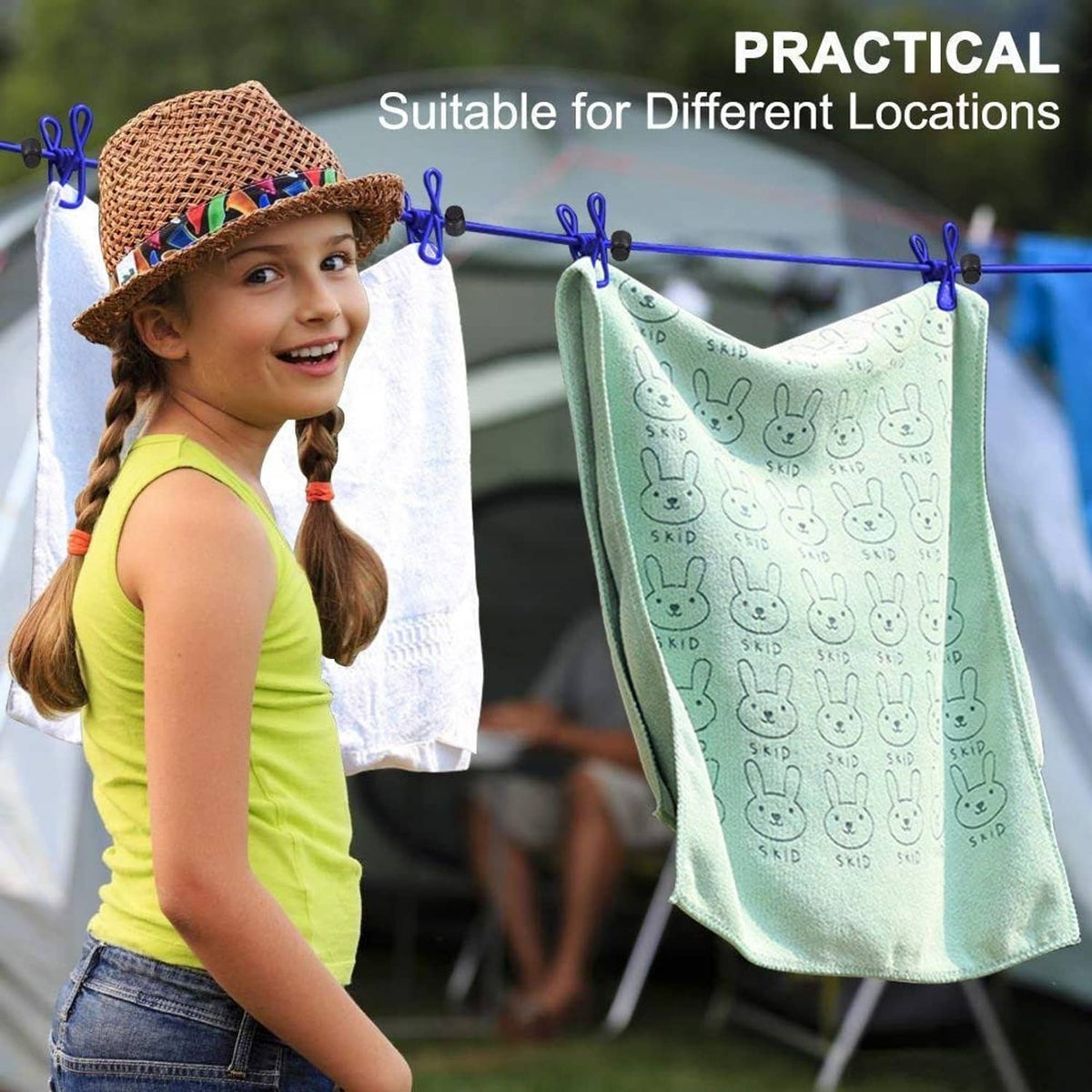Green cloth with bunny print clipped to a portable clothesline