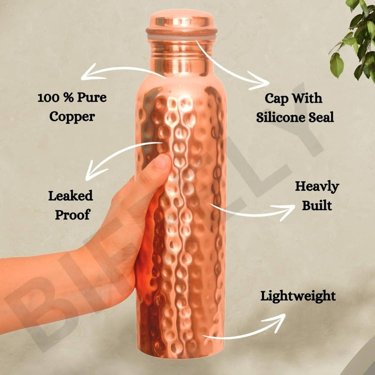 Copper water bottle with hammered finish and screw cap with silicone seal.