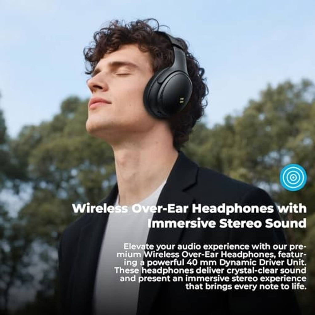 Black over-ear wireless headphones worn on a person’s head, side view outdoors