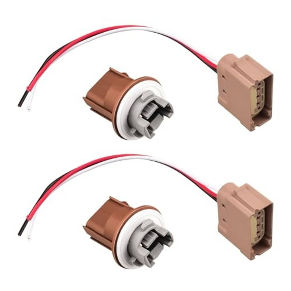 Two turn signal connector plugs with pigtail wires; tan/brown housings, white socket, red/black leads.