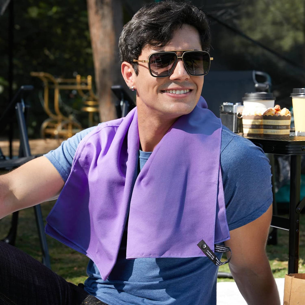 Man wearing a violet microfiber towel around his neck outdoors