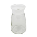 Glass sugar pourer with white pop-up spout and clear body