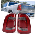 Pair of red tail light assemblies with clear lens and chrome accents