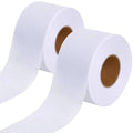 White fusible batting tape roll for quilting, with two tape sections shown