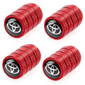 Red tire valve stem caps with Toyota logo, textured grip, black base, 2-pack