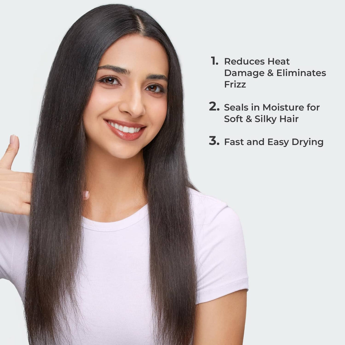 Woman with long, smooth straight dark hair, ready for styling