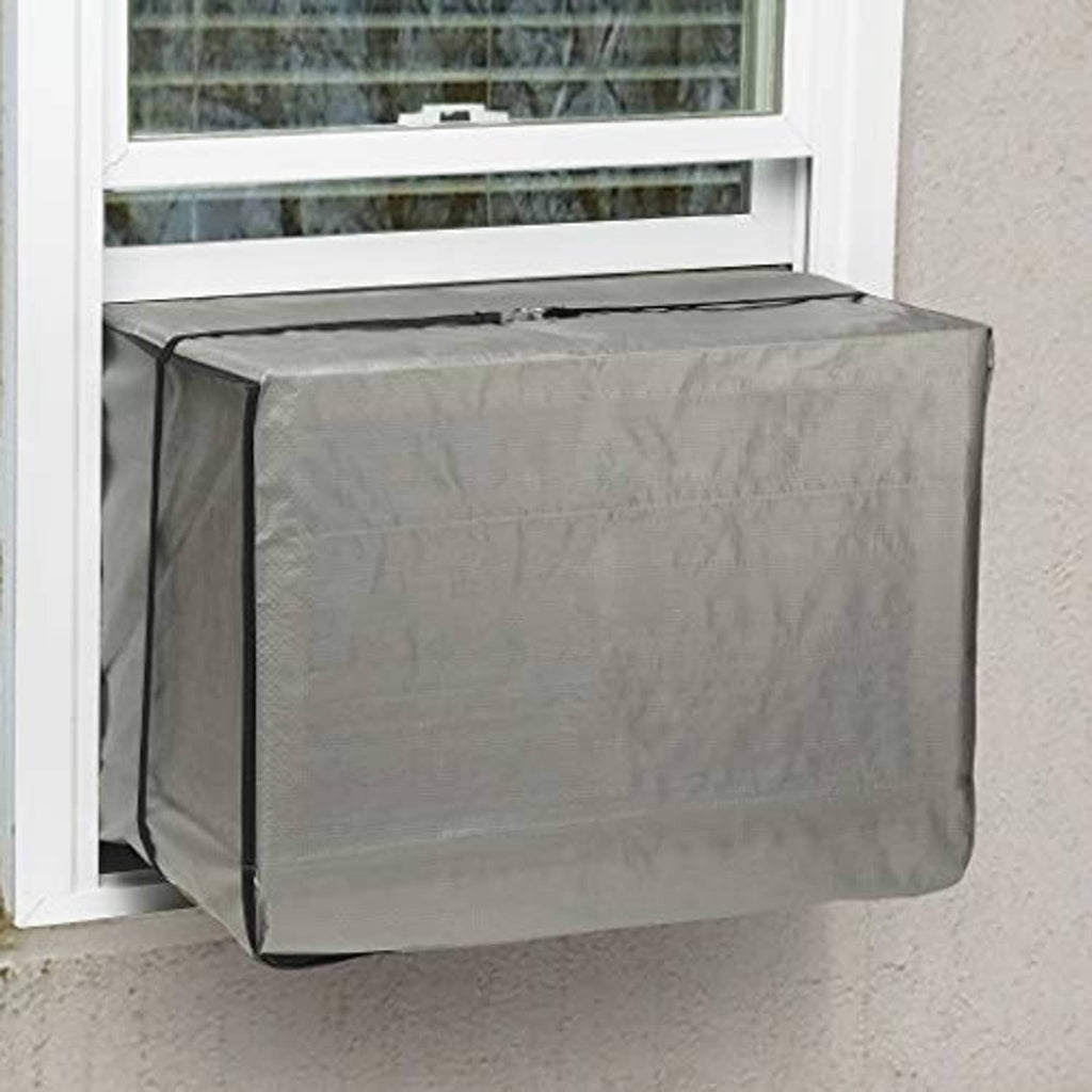 Gray window air conditioner cover fitted over outdoor AC unit in a window opening