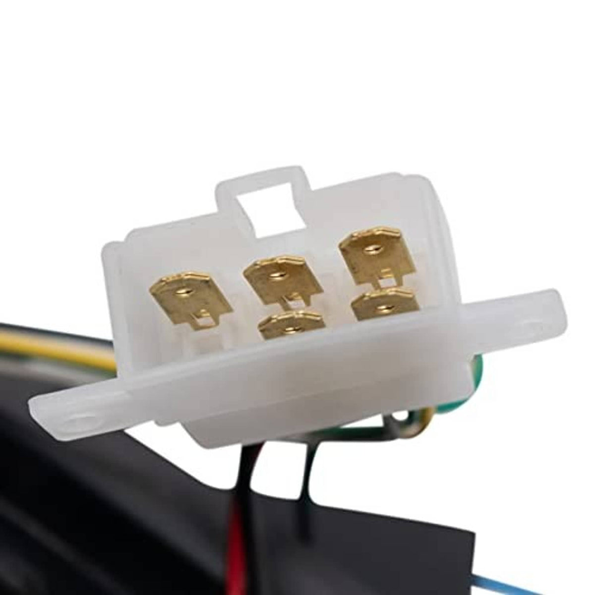 Close-up of LED tail light wiring connector with gold terminals on a white plug