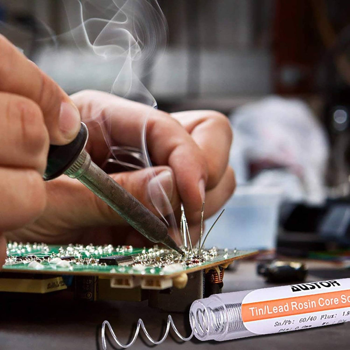 Rosin-core solder wire being used with a soldering iron on a circuit board